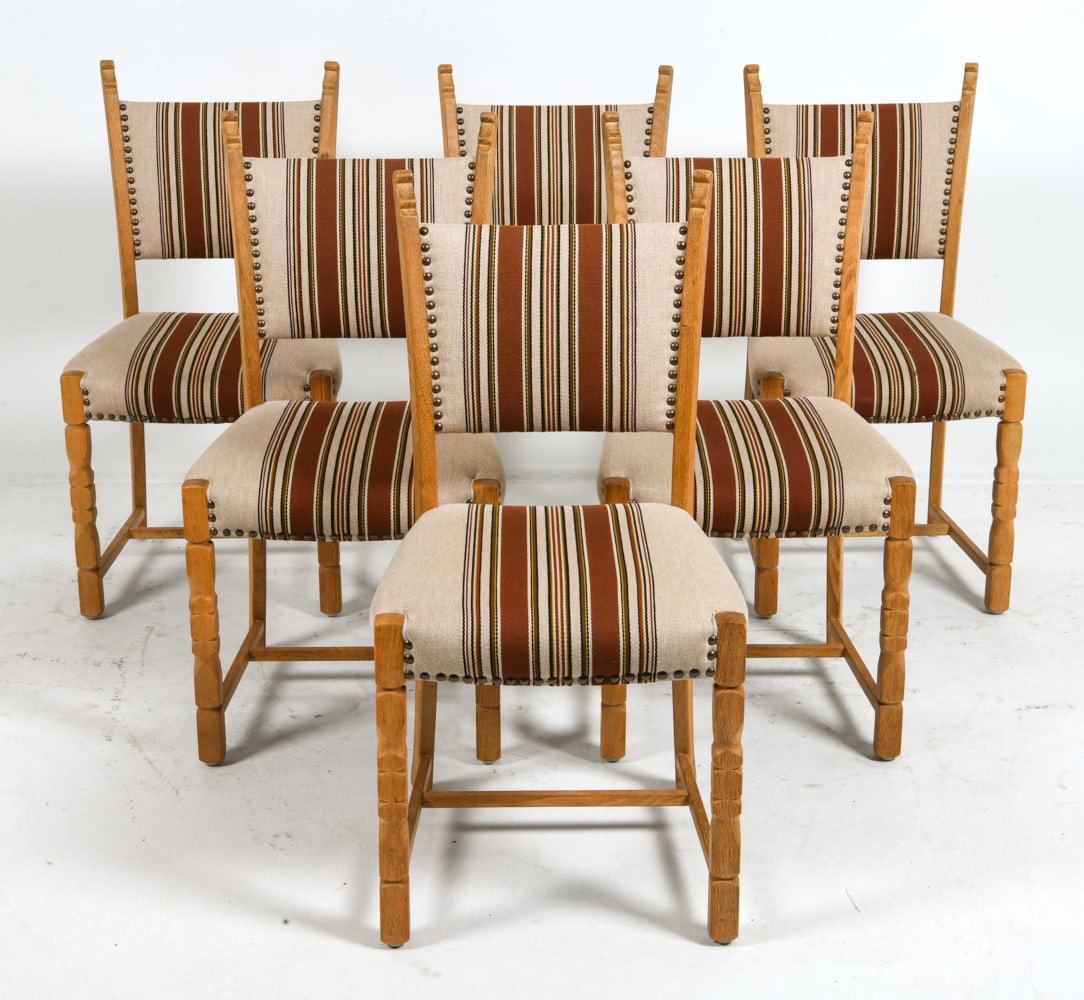 (6) KJAERNULF STYLE DANISH OAK DINING CHAIRS 1970S: Oak frames with striped upholstery. Brass tacks accents. Denmark, circa 1970s. Dimensions: H 37" x W 19" x D 20.5" x Sh 18.25". Conditions: Wear consistent with age and use, including minor dings and