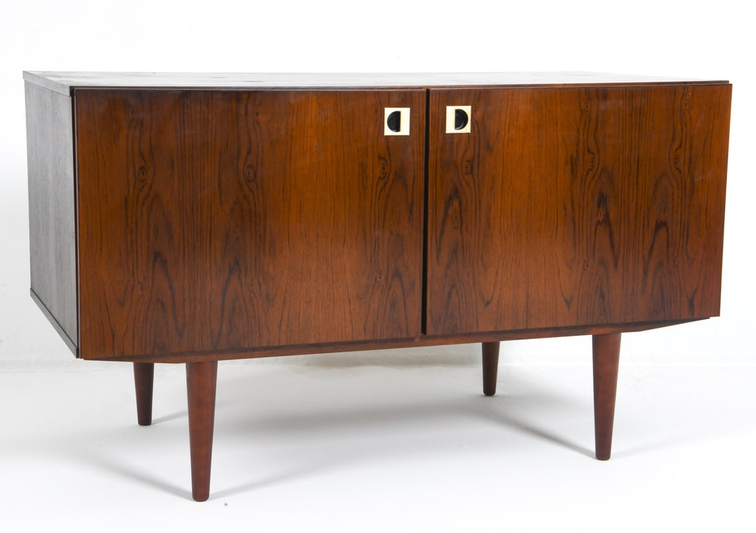 DANISH ROSEWOOD CABINET C. 1970S: Adjustable shelves. Denmark, circa 1970s. Dimensions: H 28" x W 47.5" x D 23.75". Condition: Minor scuffs and scratches, wear consistent with age and use. DMU077
