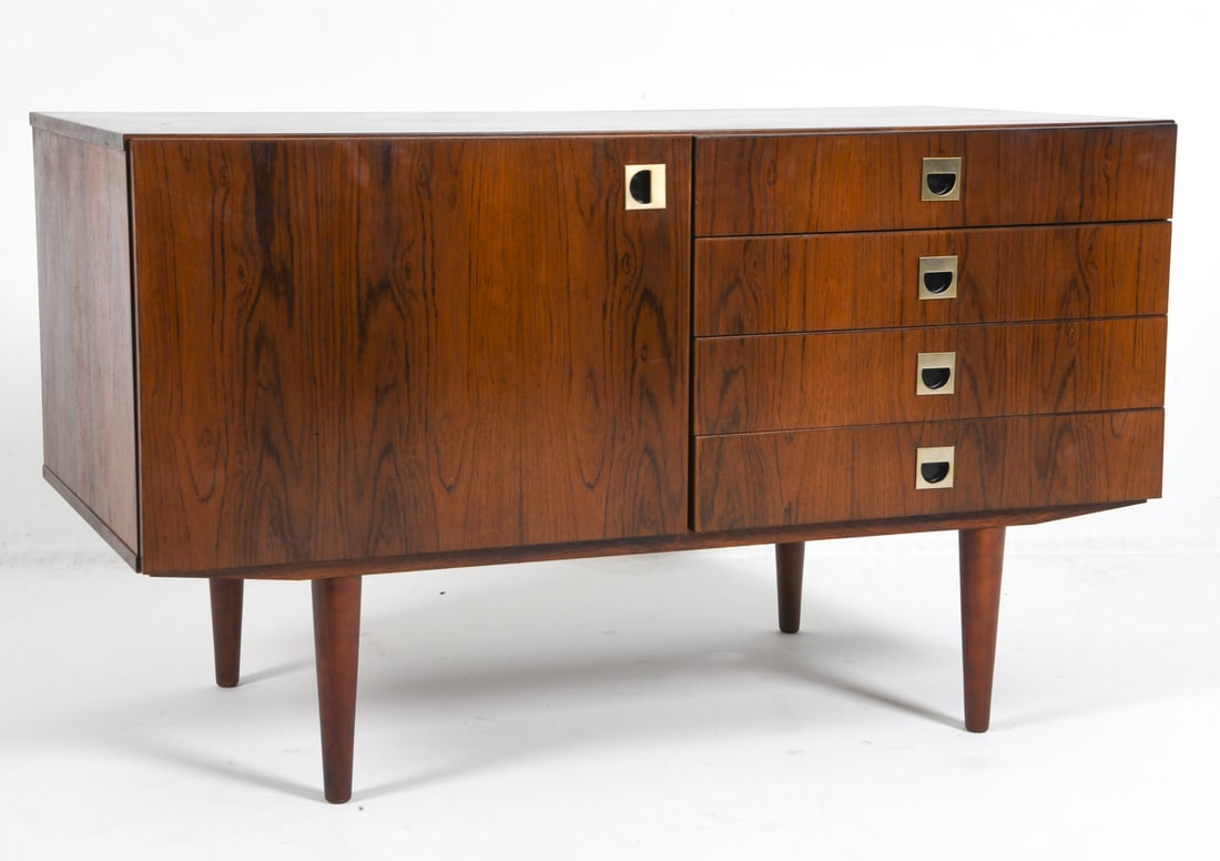 DANISH ROSEWOOD CABINET C. 1970S: Adjustable shelves. Metal pulls. Denmark, circa 1970s. Dimensions: H 21.5" x W 47.5" x D 23.5". Condition: Minor surface scratches. Wear consistent with age and use. DMU076