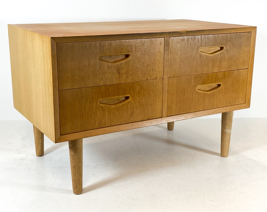OLHOLM MOBEL DANISH OAK CHEST OF DRAWERS C. 1970S: Stamped to back. Denmark, circa 1970s. Dimensions: H 20.25" x W 31.5" x D 17.5". Conditions: Wear consistent with age and use, including dings and rubs. Sun fading to top. DMU112