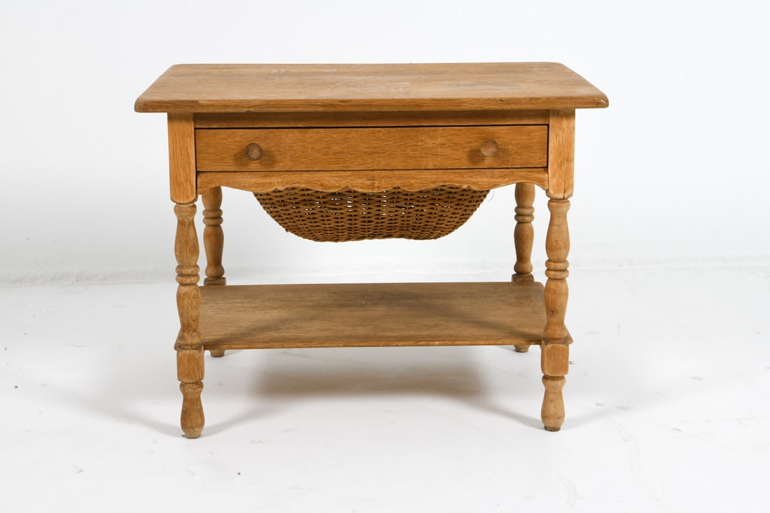 HENNING KJAERNULF DANISH OAK SEWING CHEST C. 1970S: Oak sewing chest with rattan basket drawer. Apparently unmarked. Denmark, circa 1970s. Dimensions: H 20.75" x W 27.75" x D 20". Condition: Minor scuffs and rubs, wear consistent with age and use. DMU1