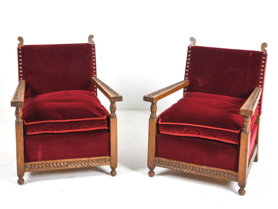 PAIR OF DANISH OAK & VELOUR ARMCHAIRS C. 1950S: Carved oak frames with red velour upholstery. Carved decoration to frames. Denmark, circa 1950s. Dimensions: H 32.5" x W 26" x D 27.5" x Sh 16.5". Conditions: Wear consistent with age and use, includi