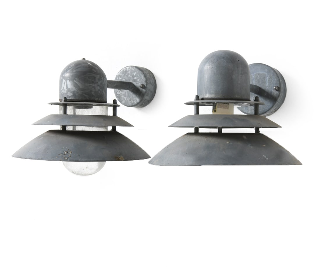 PAIR OF NORDLUX OUTDOOR SCONCES: Dimensions: H 8.5" x W 11" x D 12.25" Conditions: Wear consistent with age and use including minor discoloration, missing glass to one sconce DMU070
