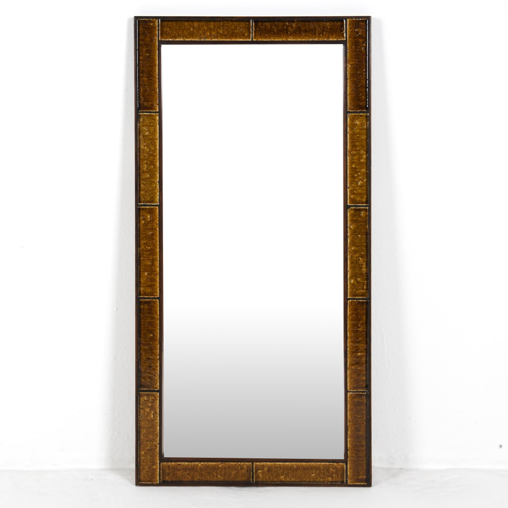 DANISH ROSEWOOD & CERAMIC TILE MIRROR C. 1960S: Rosewood framed mirror featuring yellow ceramic glazed inset tiles. Denmark, circa 1960s. Dimensions: H 39.5" x W 19.75" Condition: Rubs and surface marks to frame, wear consistent with age and use.