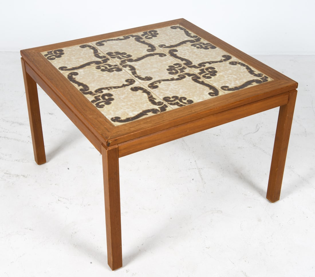DANISH TEAK & TILE COFFEE TABLE C. 1970S: Teak coffee table with ceramic tiles inlaid to top. Denmark, circa 1970s. Dimensions: H 20.25" x W 28.5" x D 28.5". Condition: Few minor scuffs and faint water spots to wood. Wear consistent with age
