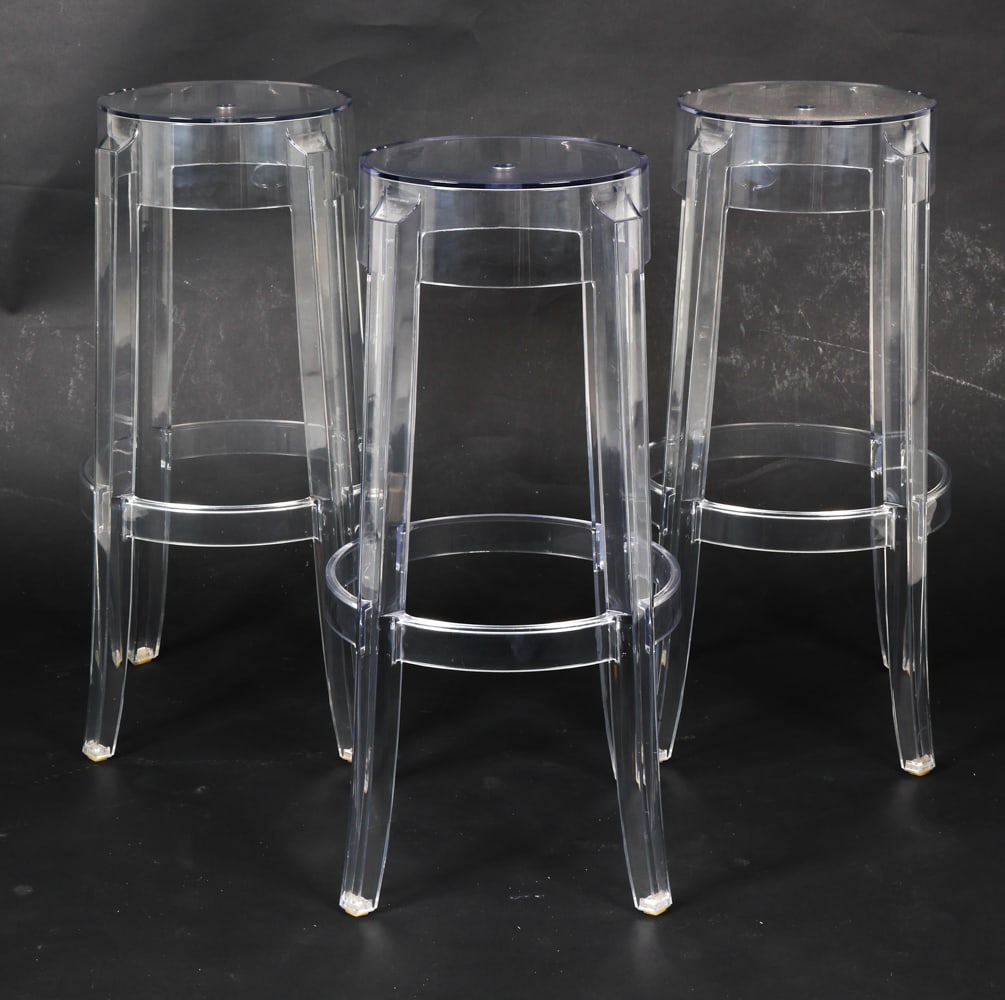 PHILIPPE STARCK KARTEL 'GHOST' BAR STOOLS: Designed by Philippe Starck for Kartel. Marked to the legs. Clear plastic. Italy. Dimensions: H 29.75" x Dia. 14.5" Conditions: Scuffs and rubs to seat and legs, wear consistent with age and use. E203