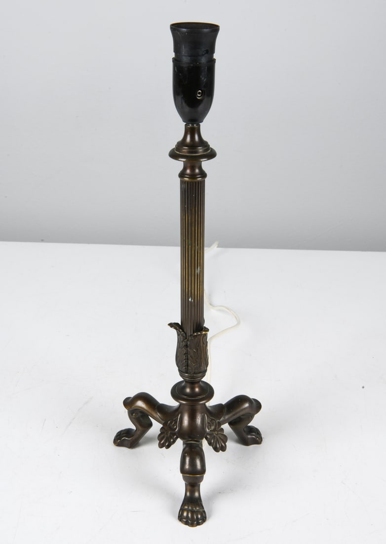 SCANDINAVIAN BRONZE TABLE LAMP: Bronze table lamp in neoclassical style with paw feet. Scandinavian, circa 1960s. Dimensions: H 17.5" x Dia. 6.5". Condition: Wiring untested, European plug. Wear consistent with age and use. CLEVG032
