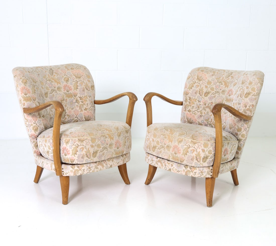PAIR OF ADOLF WRENGER GERMAN LOUNGE CHAIRS C.1940S: Pair of lounge chairs featuring floral pattern upholstery and Beechwood arms and legs. Tagged on undersides. Germany, circa 1940s. Dimensions: H 29" x W 23.75" x D 28" x Sh 16.75" Conditions: Wear con