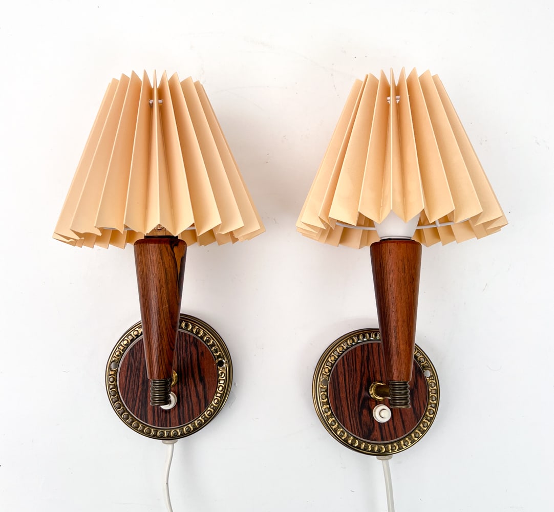 PAIR OF DANISH ROSEWOOD & BRASS SCONCES: Rosewood sockets with brass arms and wall mount. Apparently unmarked. Dimensions: H 9" x W 6" x D 6" Conditions: Wear consistent with age and use, break to lampshade. Untested, European plugs. ES2-151