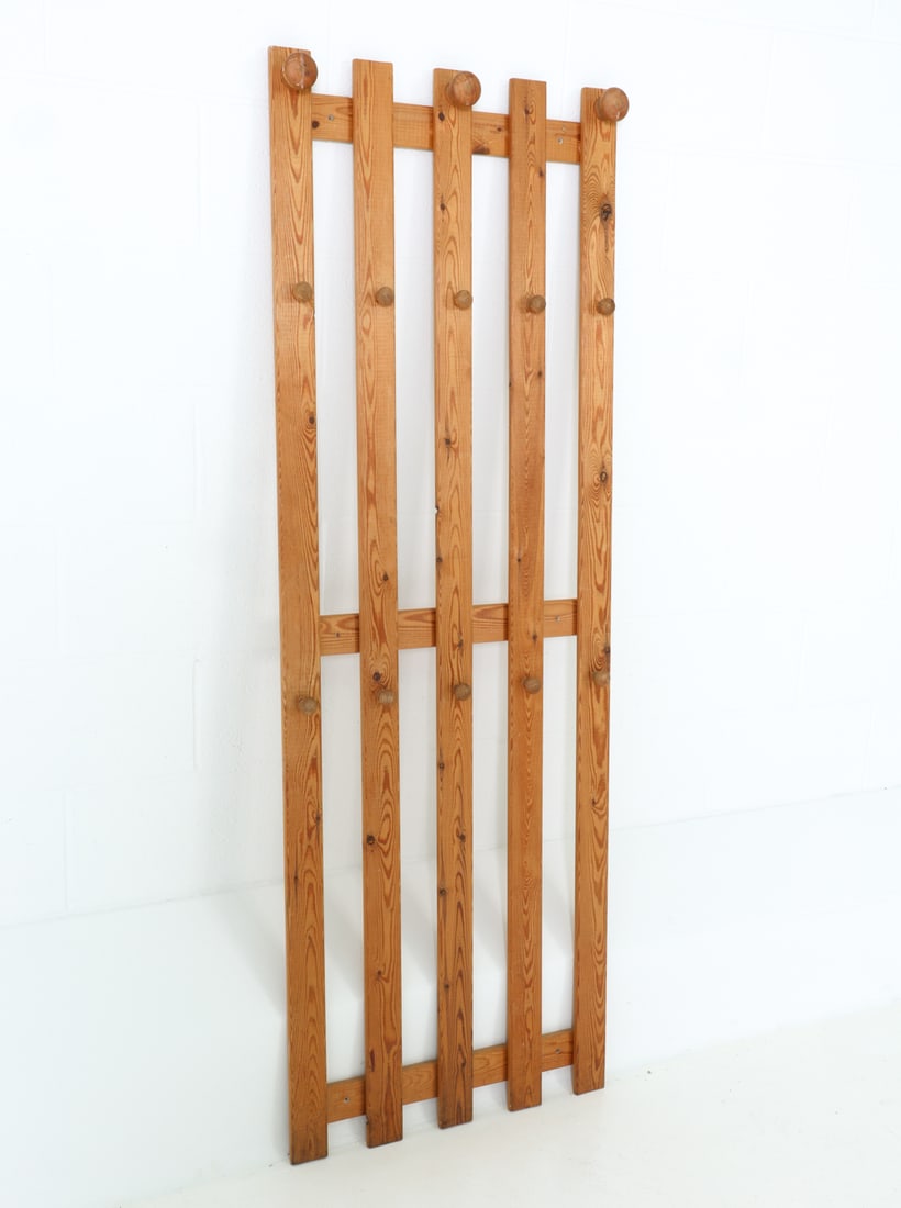 STYLE OF KARIN MOBRING SWEDISH PINE COAT RACK: Coat rack with three large knobs at the top and ten smaller knobs below. Sweden, circa 1970s. Dimensions: H 67" x W 23.25" x D 2.75" Condition: Light marks and surface wear consistent with age and use