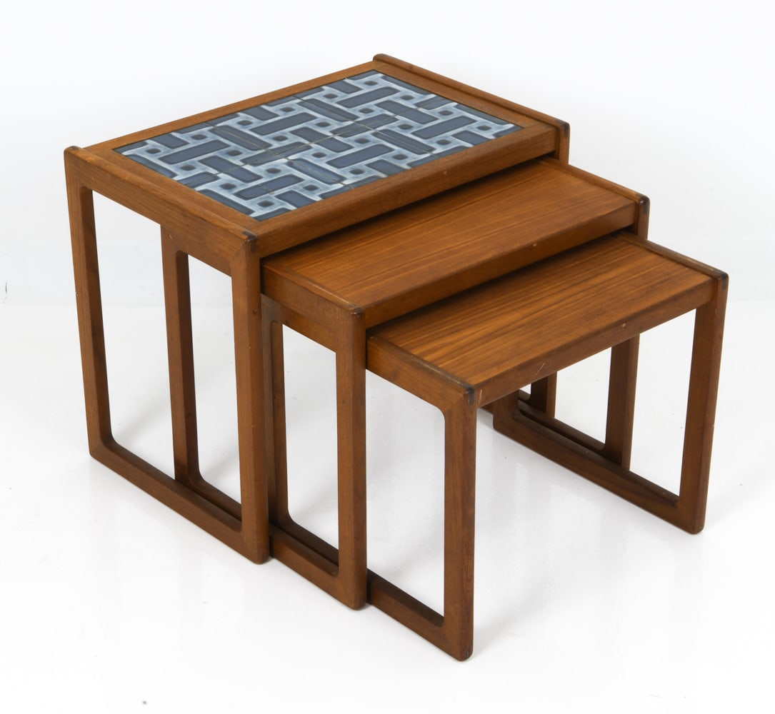 KURT OSTERVIG DANISH TEAK NESTING TABLES C. 1960S: For Jason mobler. Set of three nesting tables with a tile top on the largest table. Stamped underneath. Denmark, circa 1960s. Dimensions: H 18.25" x W 22" x D 15" Condition: Wear consistent with age a