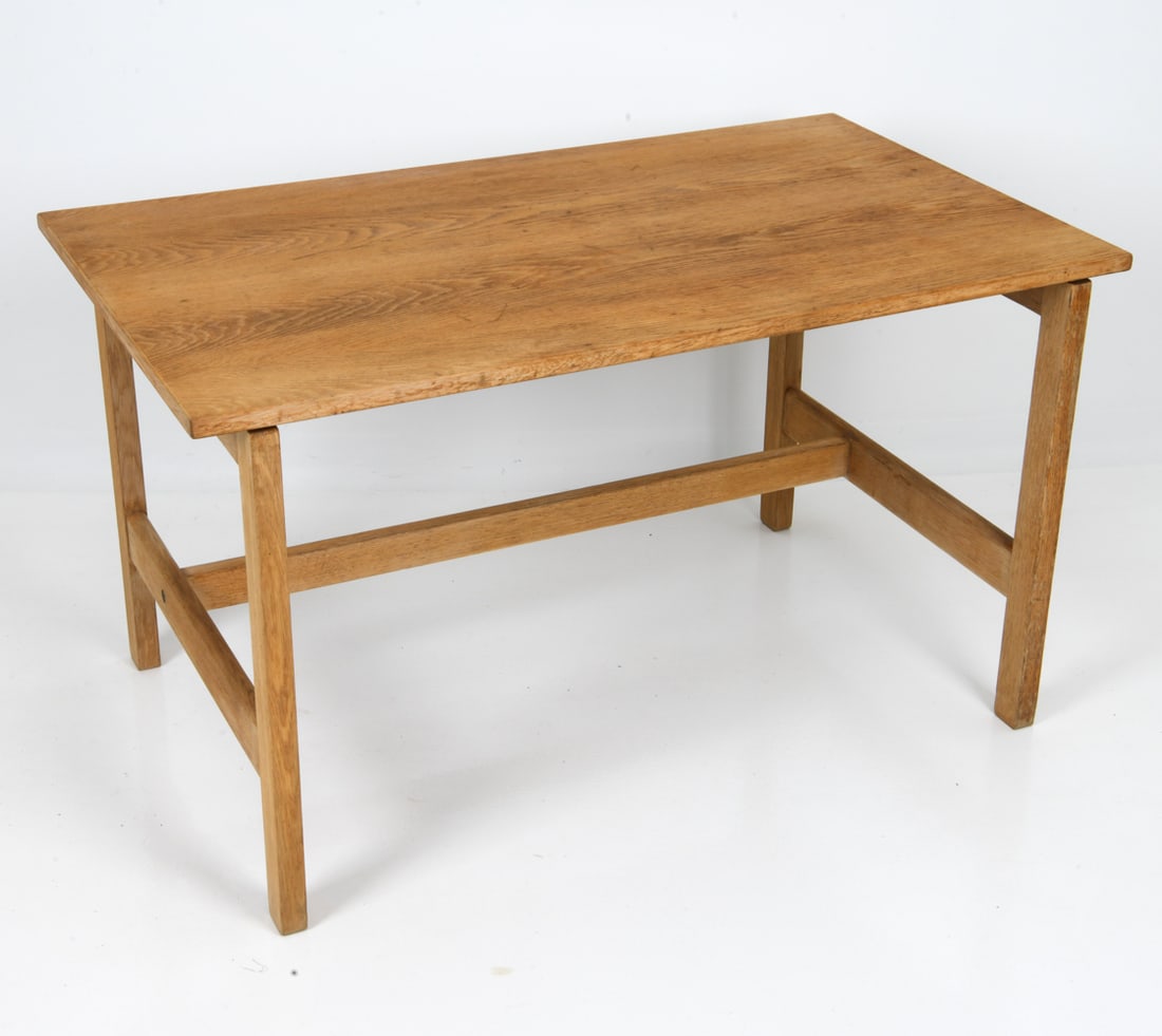 HANS WEGNER FOR GETAMA DANISH OAK TABLE C. 1970S: Oak table with a plank top and legs with stretcher. Apparently unmarked. Denmark, circa 1970s. Dimensions: H 26.75" x W 47.25" x D 27.5" Condition: Wear consistent with age and use, including rubs and