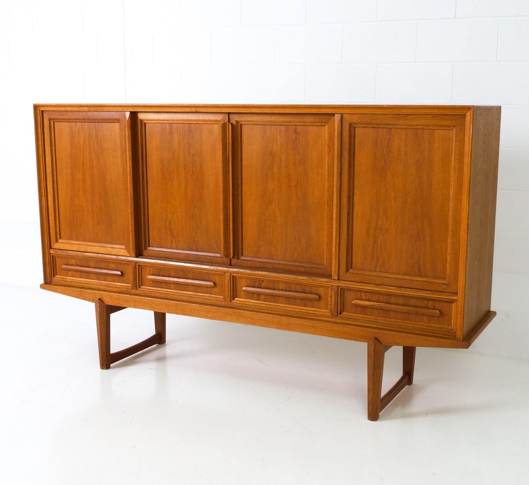 DANISH OAK SIDEBOARD C. 1960S: Sideboard cabinet made from oak featuring four drawers at the bottom and three compartments at the top for shelves and drawers. Denmark, circa 1960s. Dimensions: H 47.5" x W 80" x D 18.75" Condition: