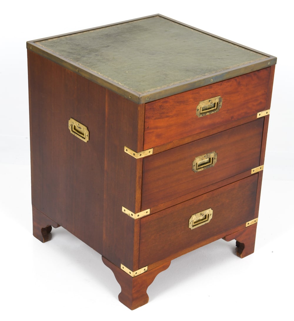 ENGLISH MAHOGANY LEATHER TOP CAMPAIGN CHEST: Mahogany chest with brass banded leather top, brass corners and Brass handles, English 20th C. Dimensions: H 23.75" x W 18.75" x D 19" Condition: Wear consistent with age and use including faint scrat