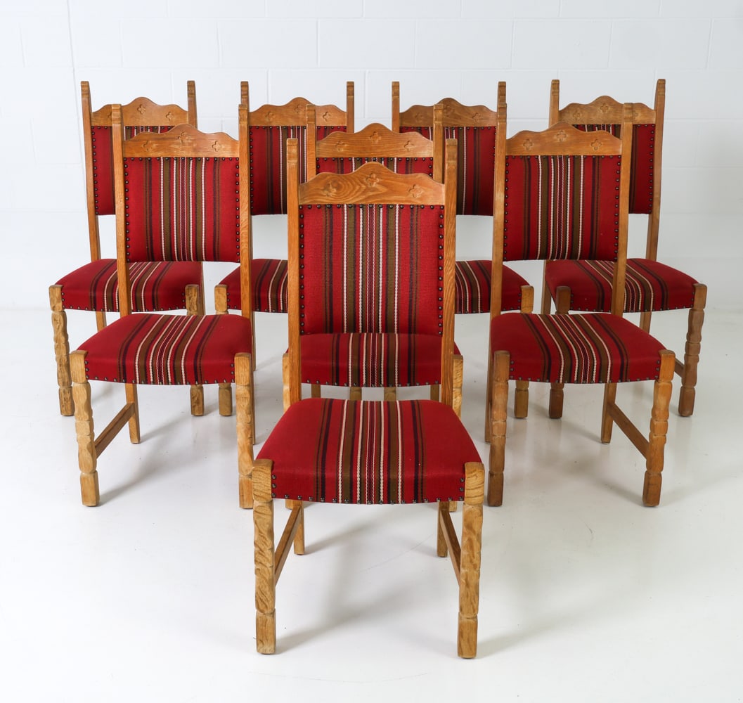 (8) KJAERNULF STYLE DANISH OAK DINING CHAIRS 1970S: 8 dining chairs in oak frames, curved backrest with quatrefoil motifs and stripped upholstery. Denmark, circa 1970's. Dimensions: H 41" x W 19" x D 18" x SH 17" Condition: Signs of use and wear consis