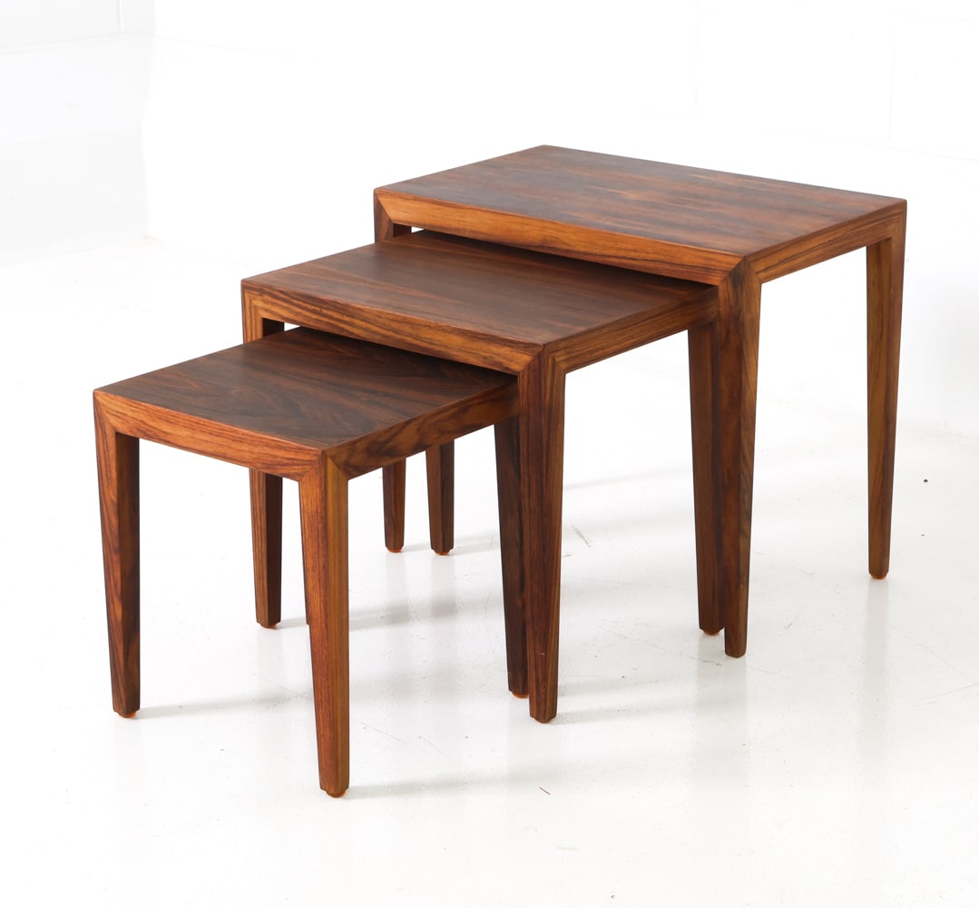(3) SEVERIN HANSEN DANISH ROSEWOOD NESTING TABLES: For Haslev. Rosewood frame. Marked with Danish maker label to underside of each tables and distributor's mark to the smallest one. Denmark, circa 1950s. Dimensions: H 20" x W 23" x D 13.75" Condition: