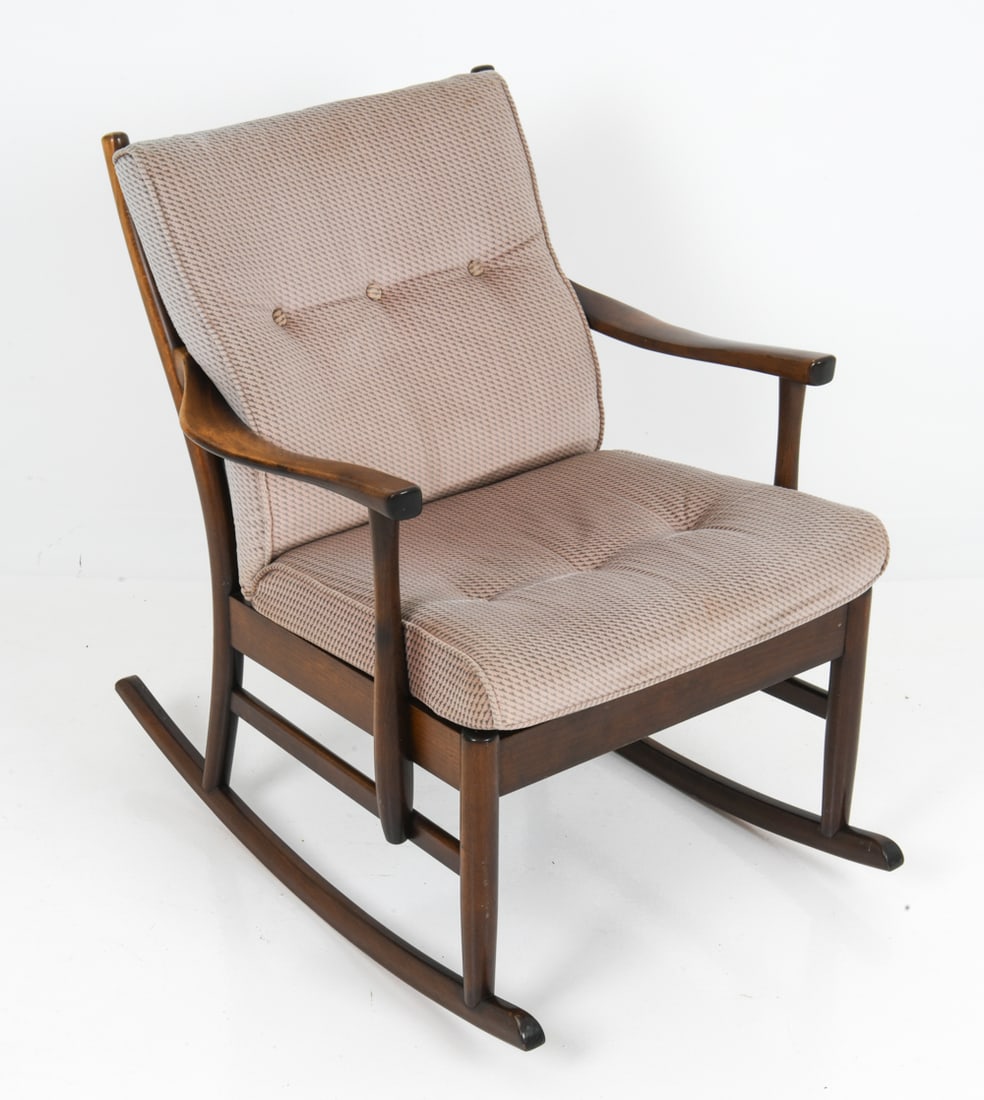 STYLE OF PARKER KNOLL ENGLISH OAK ROCKING CHAIR: Striped fabric upholstery with an oak frame and sculpted armrests. English, circa 1970s. Dimensions: H 34.75" x W 26.25" x D 29" x Sh 18.5" Condition: Wear consistent with age and use including rubs a