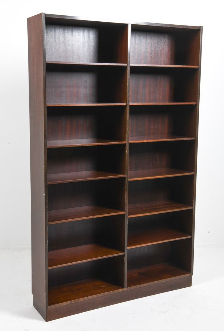 STYLE OF HUNDEVAD DANISH ROSEWOOD BOOKCASE: Adjustable shelves. Retailers tag on back. Denmark. Dimensions: H 78" x W 49" x D 11". Condition: Some minor scuffs. Wear consistent with age and use.
