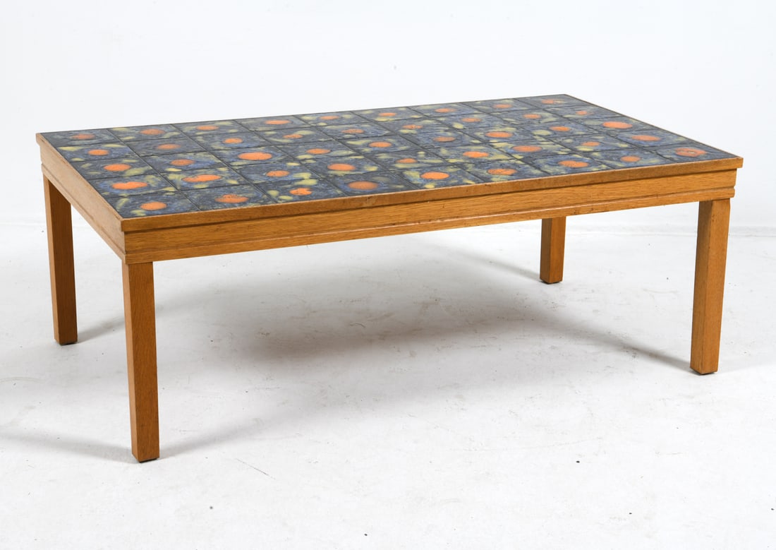 STYLE OF TORNEMAN SWEDISH OAK & TILE COFFEE TABLE: Oak coffee table with ceramic tiles inlaid to top. Sweden, circa 1960s. Dimensions: H 20" x W 54.5" x D 31". Condition: Some minor scuffs and dings to legs. Wear consistent with age and use.
