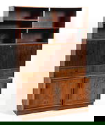 ATTR. HUNDEVAD DANISH ROSEWOOD BOOKCASE C. 1960S: Key included. Consists of (3) pieces that are stacked freely upon the other. Adjustable shelves. Denmark, circa 1960s. Dimensions: H 69.5" x W 46" x D 16". Condition: Wear consistent with age and