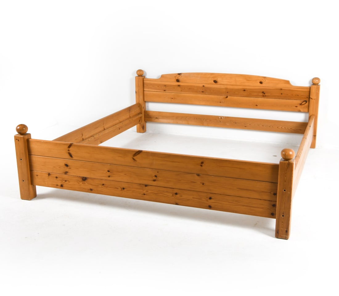 STYLE OF SVEN LARSSON SWEDISH PINE QUEEN BED FRAME: Sweden, circa 1970s. Dimensions: H 28" x W 74" x D 83". Interior W 71.5" x D 78" Condition: Some Scratches and Scuffs. Missing middle Support Beam. Wear consistent with age and use.