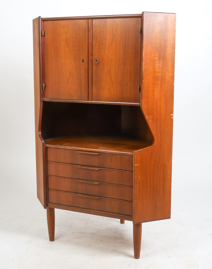 OMANN JUN DANISH TEAK CORNER CABINET C. 1960S: Key included. Frosted decorated mirror backing inside. Apparently unmarked. Denmark, circa 1960s. Dimensions: H 53.5" x W 35.25" x D 21.75". Condition: Wear consistent with age and use, including ding
