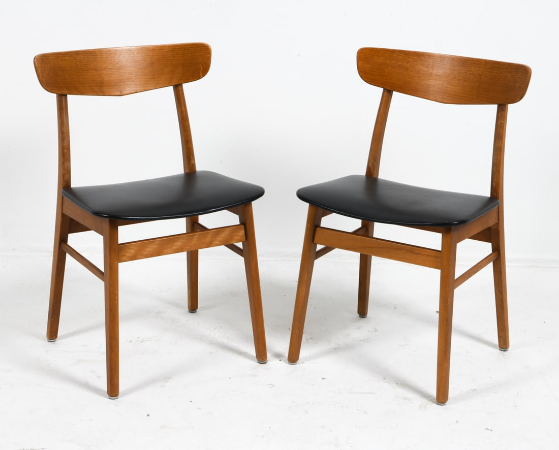 PAIR FARSTRUP DANISH TEAK DINING CHAIRS C. 1970S: Pair of dining chairs with teak frames and black leather upholstery. Apparently unmarked. Denmark, circa 1970s. Dimensions: H 30.5" x W 18" x D 16" x SH 18" . Condition: Wear consistent with age and u