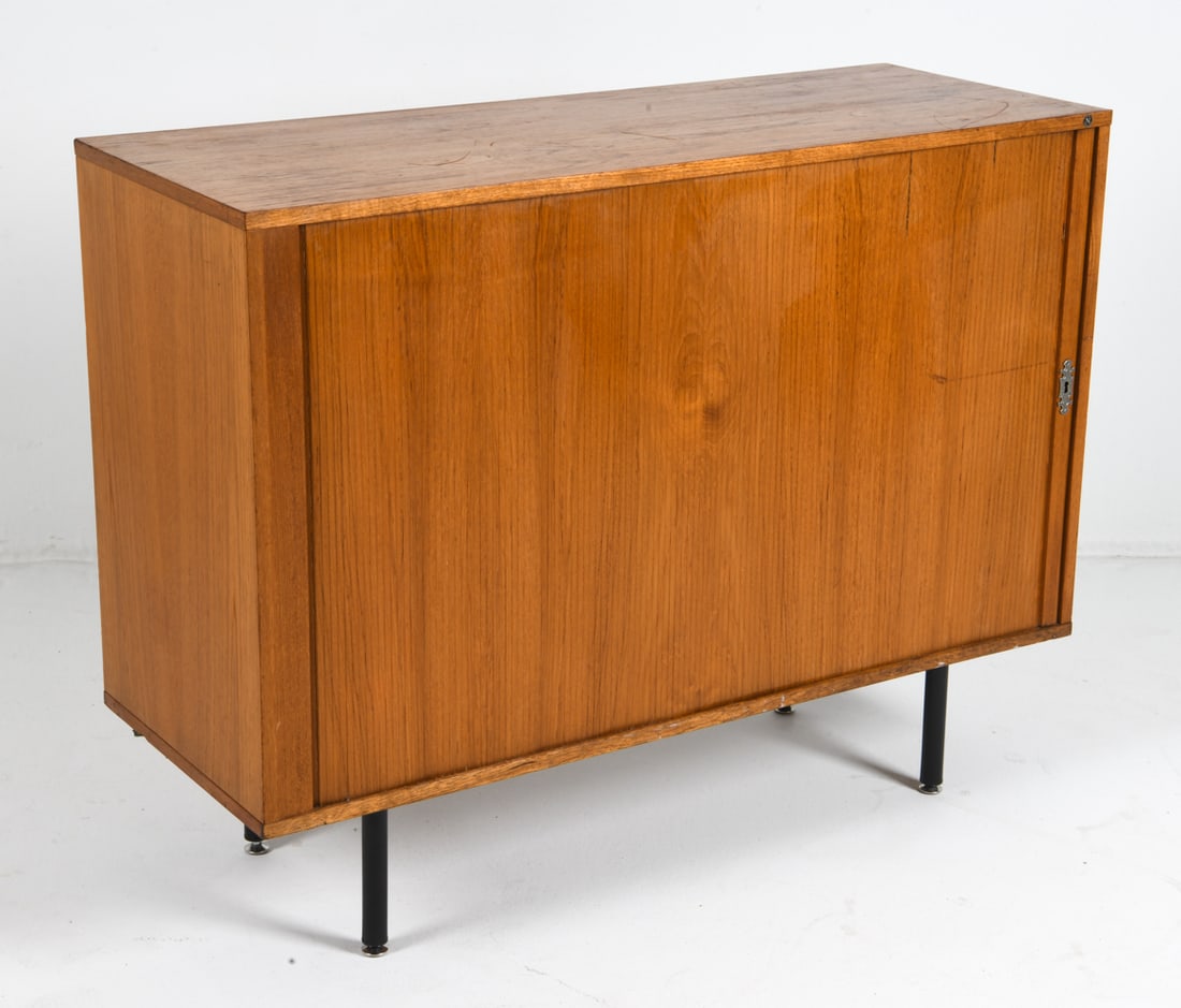 NIPU DANISH TEAK TAMBOUR CABINET C. 1970S: Tagged to top front edge. Denmark, circa 1970s. Dimensions: H 37" x W 48" x D 18". Condition: Scratches and dings to surface, Wear consistent with age and use.