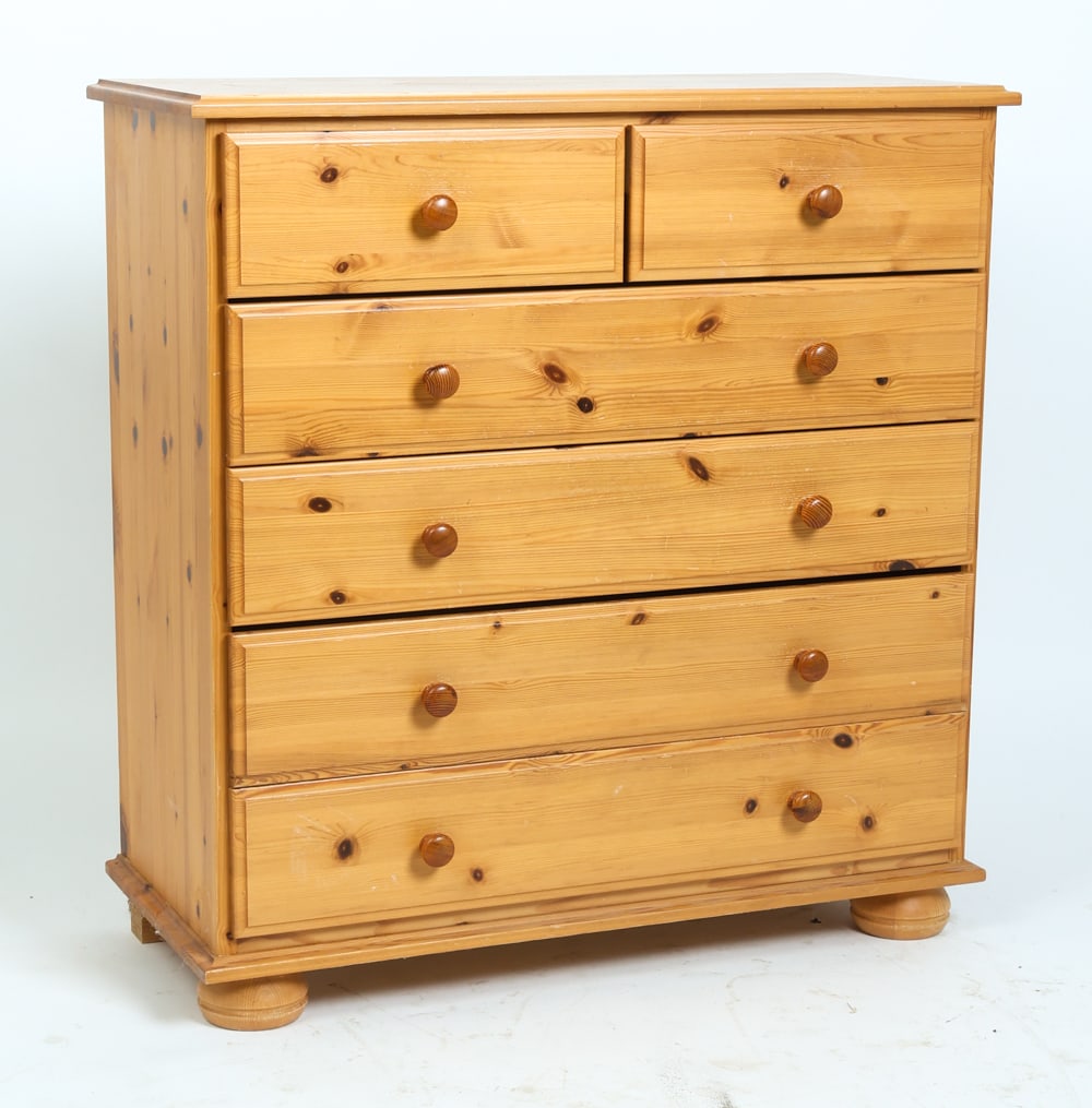 SWEDISH PINE CHEST OF DRAWERS C. 1970S: Pine chest of drawers with five drawers and round shaped pulls. Sweden, circa 1970s. Dimensions: H 34.75" x W 33.5" x D 14.5". Condition: Wear consistent with age and use including scratches and dings