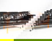 HURUP MOBLER DANISH LEATHER SOFA C. 1970S: Tagged to fabric lining. Brown leather upholstery with beech legs. Denmark, circa 1970s. Dimensions: H 31.5" x W 84.75" x D 32.25" x Sh 16.25". Condition: Wear consistent with age and use including mi