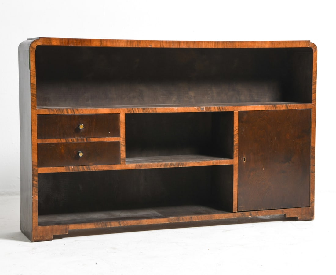 SCANDINAVIAN ART DECO BIRCH BOOKSHELF C. 1940S: Birch bookshelf with drawers and cabinet. Scandinavian, circa 1940s. Dimensions: H 32" x W 51" x D 10". Condition: No key. Sun minor fading. Wear consistent with age and use. Scuffs and scratches.