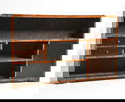 SCANDINAVIAN ART DECO BIRCH BOOKSHELF C. 1940S: Birch bookshelf with drawers and cabinet. Scandinavian, circa 1940s. Dimensions: H 32" x W 51" x D 10". Condition: No key. Sun minor fading. Wear consistent with age and use. Scuffs and scratches.