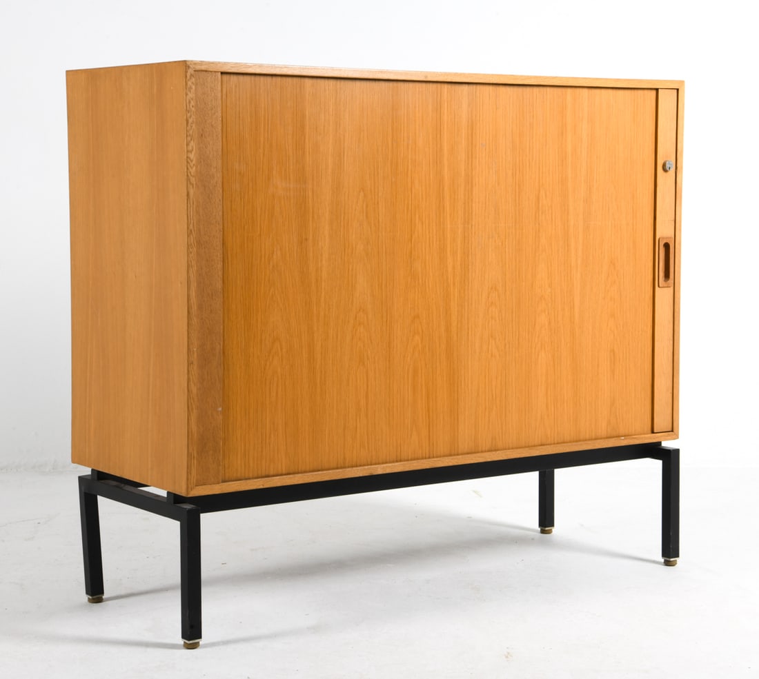 DANISH TEAK TAMBOUR CABINET C. 1960S: Teak cabinet with sliding tambour door. Denmark, circa 1960s. Dimensions: H 38" x W 44" x D 17". Condition: Some dings. No key included. Wear consistent with age and use.