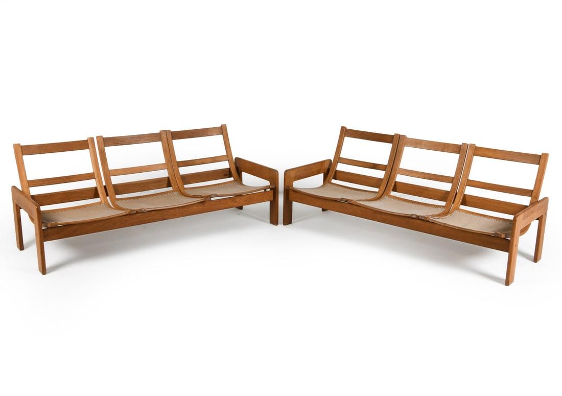 PAIR OF YNGVE EKSTROM FOR SWEDESE OAK SOFAS 1970S: Pair of oak sofa frames. Marked to backs. Sweden, circa 1970s. Dimensions: H 27.5" x W 69.5" x D 25" x Sh 12.75" Condition: Wear consistent with age and use including rubs and dings, stress crack pres