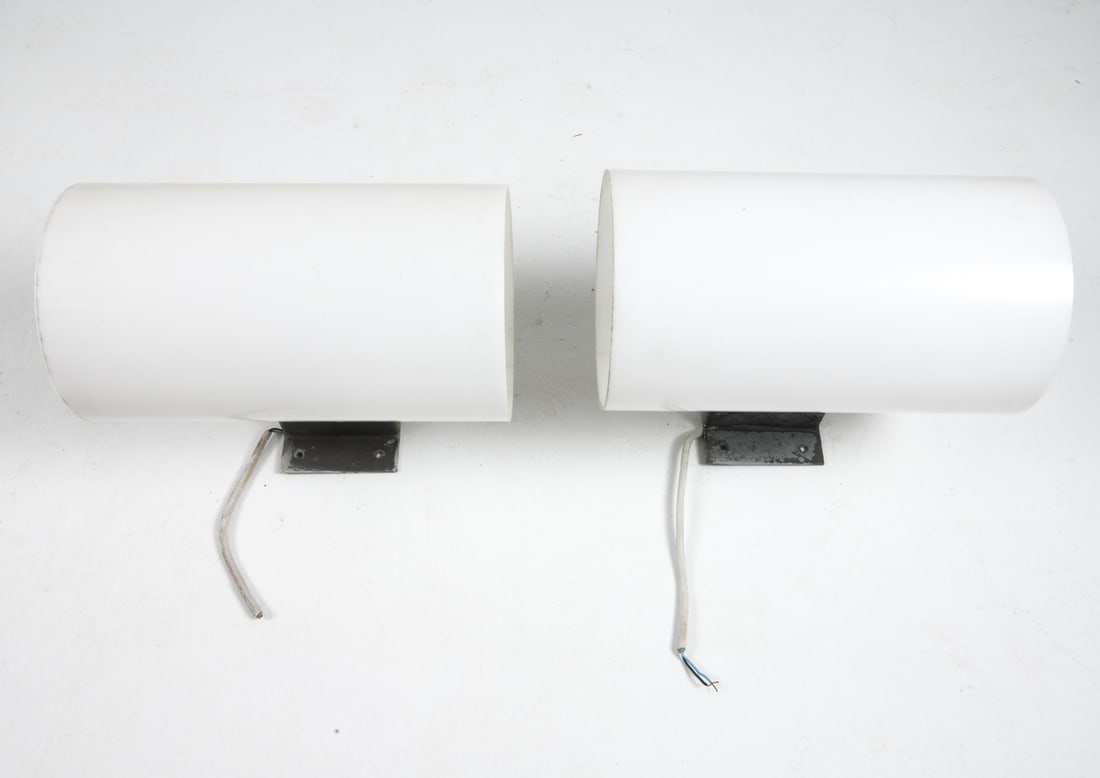 PAIR OF FOG & MORUP ACRYLIC SCONCES C. 1980S: Pair of outdoor sconces with large cylindrical acrylic shade and steel wall brackets. Scandinavian, circa 1980s. Dimensions: H 19" x W 10.75" x D 17". Condition: Wiring untested. Scuffs and scratches