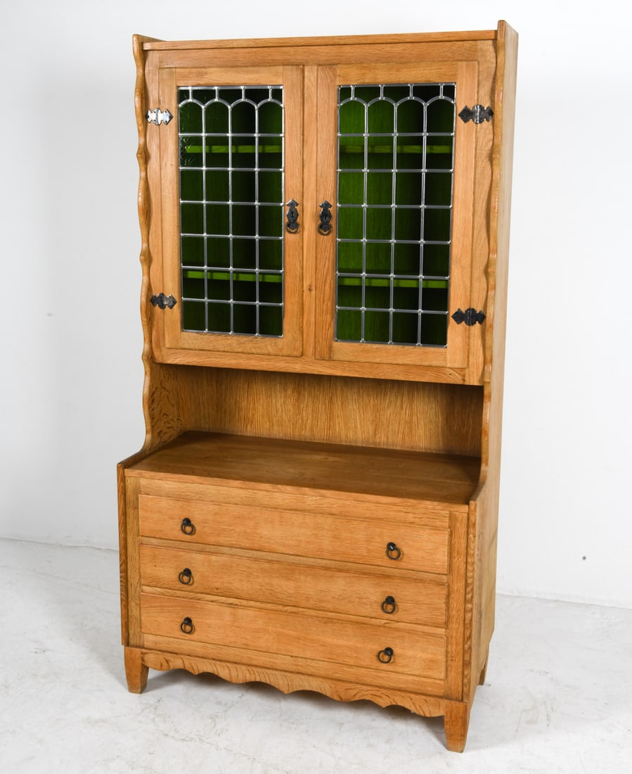STYLE OF KJAERNULF DANISH OAK CABINET C. 1970S: Key included. Glass panels to cabinet doors with green tint. Adjustable shelves. Denmark, circa 1970s. Dimensions: H 72.75" x W 39.25" x D 17.75". Condition: Wear consistent with age and use