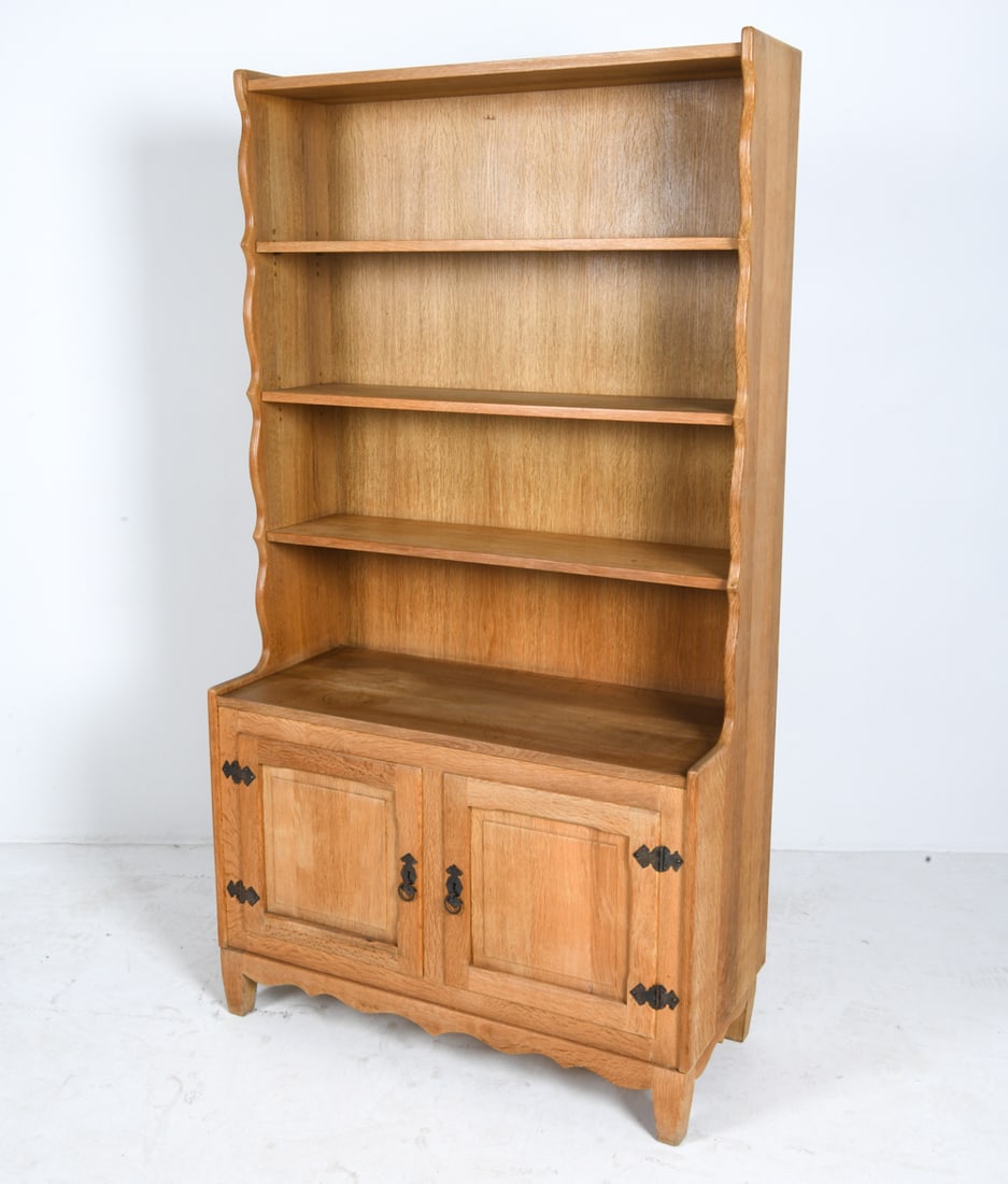 ATTR. HENNING KJAERNULF DANISH OAK CABINET C.1970S: Key Included. Adjustable shelves. Denmark, circa 1970s. Dimensions: H 72.5" x W 39.25" x D 17.5". Condition: Wear consistent with age and use including faint water ring to shelf, sun-fading to