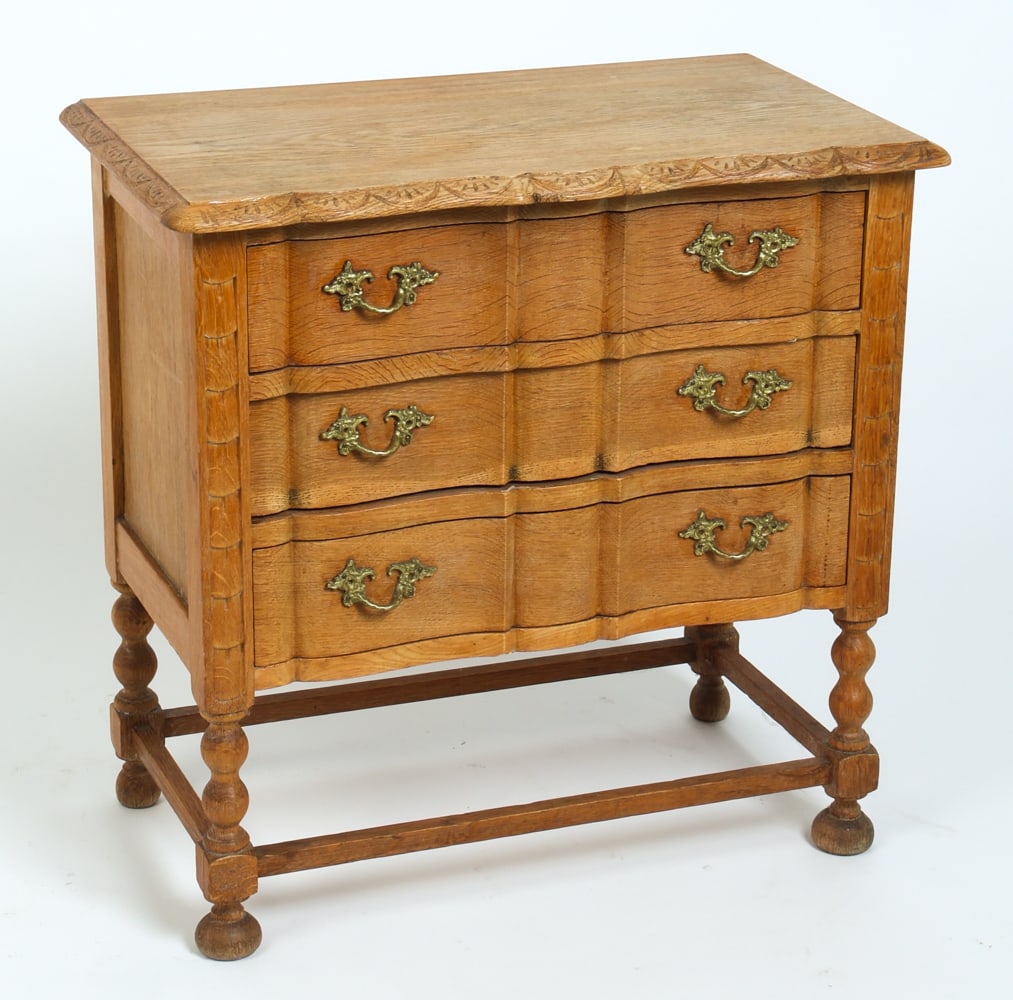 ATTR HENNING KJAERNULF DANISH OAK SIDE CHEST 1970S: Serpentine curved front with brass pulls. Denmark, circa 1970s. Dimensions: H 25" x 25.5" x D 14". Condition: Sun fading on surface. Surface soiling in drawers. Wear consistent with age and use.