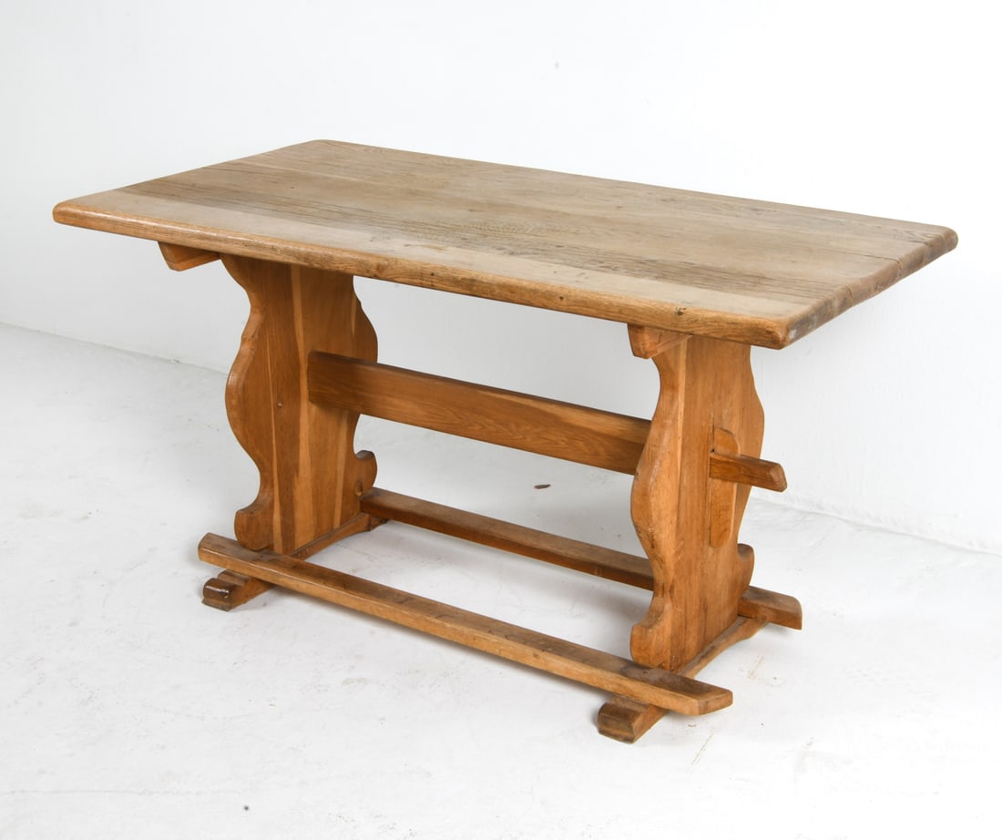 KJAERNULF STYLE DANISH OAK DINING TABLE C. 1970S: Oak dining table with trestle style base. Denmark, circa 1970s. Dimensions: H 29" x W 53" x D 28.5". Condition: Sun fading on top. Few stress cracks on top. Wear consistent with age and use.