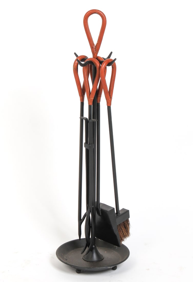 FRENCH LEATHER & IRON FIREPLACE TOOLS C. 1970S: Set of fireplace tools with leather wrapped handles. France, circa 1970s. Dimensions: As Displayed H 37" x Dia. 10.5". Condition: Wear consistent with age and use minor nicks and rubs to leather handl