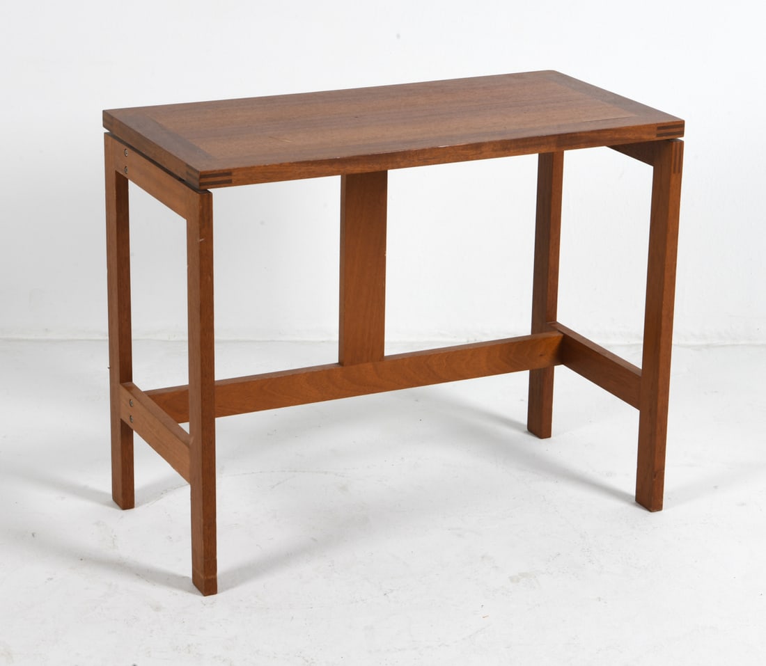 JENSEN & VALEUR FOR MUNCH DANISH TEAK TABLE: Designed by Henning Jensen and Torben Valeur for Munch, Denmark. Teak side table. Tagged underneath. Denmark, circa 1970s. Dimensions: H 28" x W 32" x D 16". Condition: Some scratches and scuffs to su