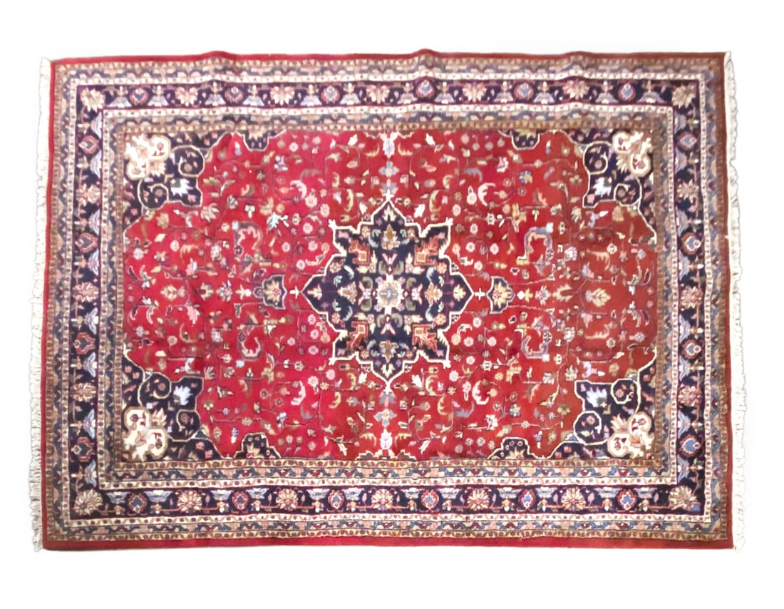 PERSIAN ORIENTAL RUG: Hand-knotted wool rug with red, blue, and cream geometric design. 20th century. Dimensions: H 143" x W 103". Condition: Wear consistent with age and use, slight fading and wear to fringe.
