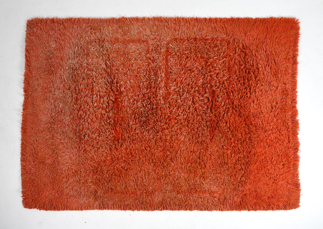 DANISH WOOL SHAG RUG: Orange shag wool rug. Denmark, circa 1970s. Dimensions: L 95" x W 70". Condition: Sun fading to pile, cleaning recommended.