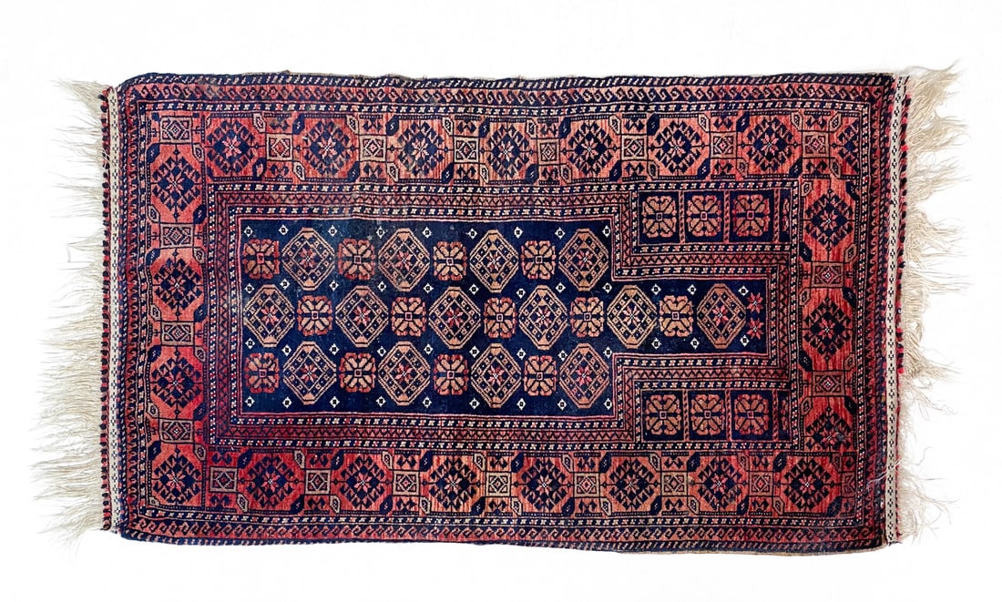 AFGHAN ORIENTAL RUG: Hand-knotted wool rug in navy geometric design. 20th century. Dimensions: H 60" x W 33". Condition: Wear consistent with age and use including minor sun-fading.