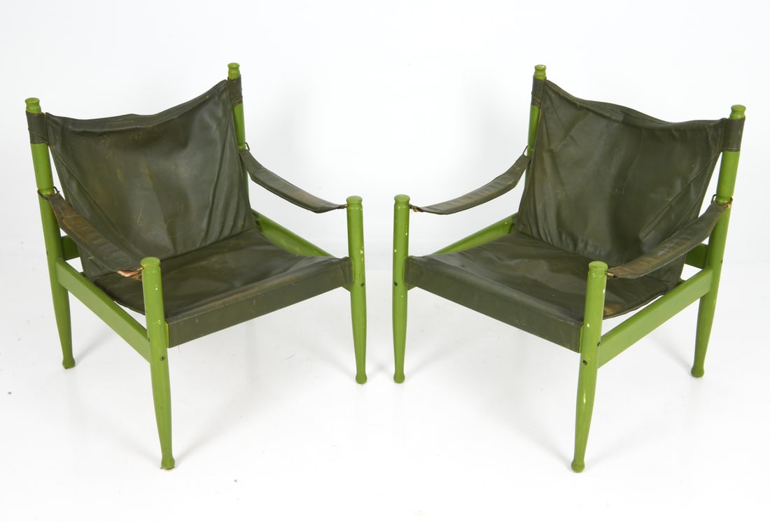 PAIR ERIK WORTS FOR EILERSEN LEATHER CHAIRS 1960S: Painted beech framed safari lounge chairs for Niels Eilersen. Leather upholstery with canvas sling. Apparently unmarked. Denmark, circa 1960s. Dimensions: H 30" x W 25.5" x D 23.5" x Sh 15" Conditions