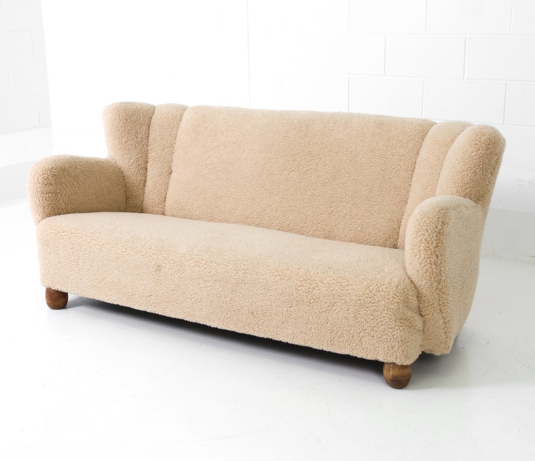 ATTR MARTHA BLOMSTEDT FINNISH LAMBSWOOL SOFA 1940S: White lambswool sofa with solid ball-shaped oak legs. Apparently unmarked. Finland, circa 1940s. Dimensions: H 29.75" x W 68.5" x D 33" x Sh 13" Condition: Wear consistent with age and use. Appears to