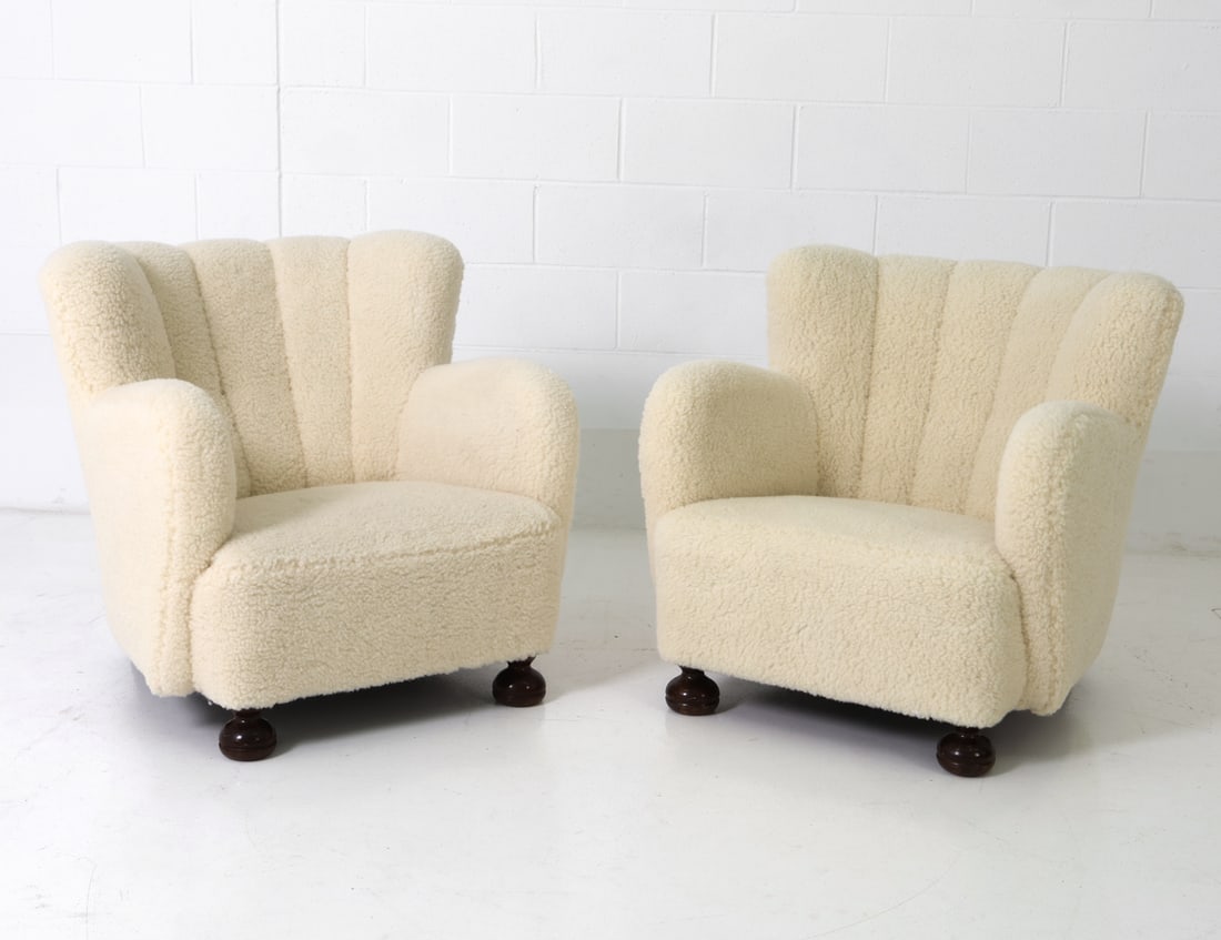 BLOMSTEDT STYLE FINNISH LAMBSWOOL LOUNGE CHAIRS: Channeled back with rounded arms and walnut feet. Finland, circa 1940s. Dimensions: H 28.75" x W 31.5" x D 31" x Sh 13.5" Condition: Minor stress crack to front right leg, wear consistent with age and