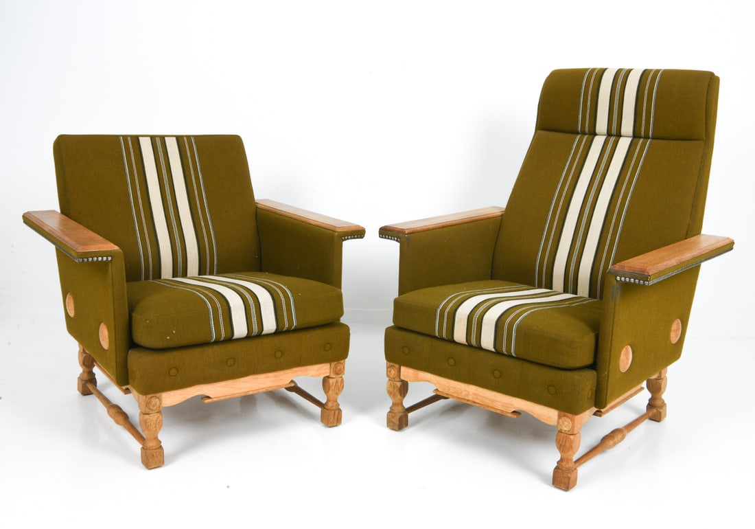 (2) ATTR HENNING KJAERNULF OAK LOUNGE CHAIRS 1970S: His and hers. Oak frame with striped upholstery. Sculpted legs and armrests. Apparently unmarked. Denmark, circa 1970s. Dimensions: H 29.75" x W 30.5" x D 29.5" x Sh 15" Condition: Patina to wooden fr