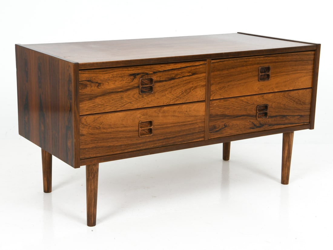 STYLE OF ARNE VODDER DANISH ROSEWOOD CHEST 1960S: Low chest of four drawers with recessed handles. Denmark, circa 1960s. Dimensions: H 19" x W 35.5" x D 16.5" Condition: Wear consistent with age and use including rubs and scuffs.