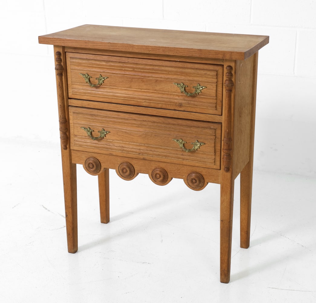 STYLE OF KJAERNULF DANISH OAK SIDE CHEST C. 1970S: Oak nightstand or end table. Two drawers with brass handles. Denmark, circa 1970s. Dimensions: H 27.5" x W 24" x D 11.25" Condition: Wear consistent with age and use including rubs and scuffs, faint w